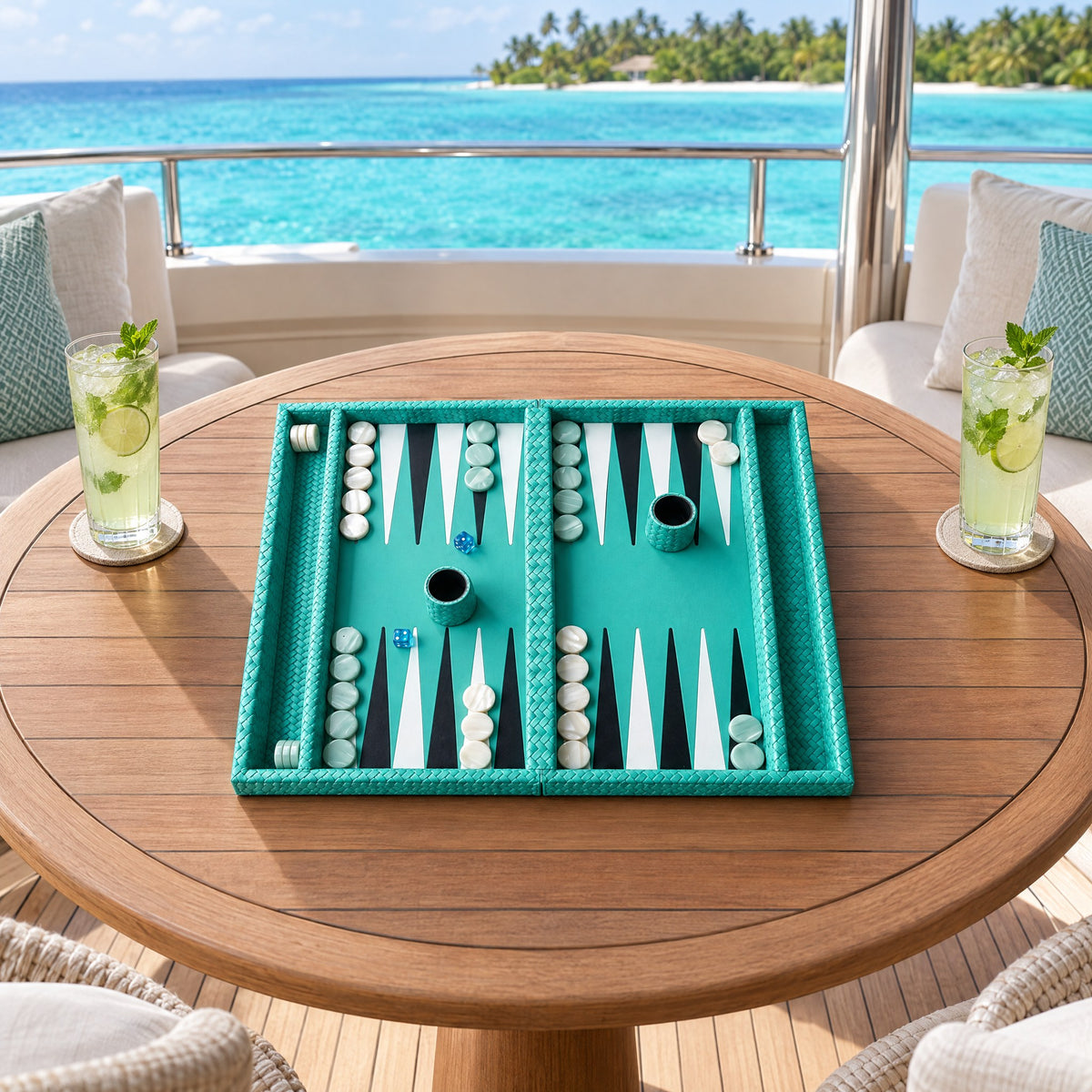 Turquoise full-grain leather backgammon set on a teak table on a yacht deck, the sea beyond