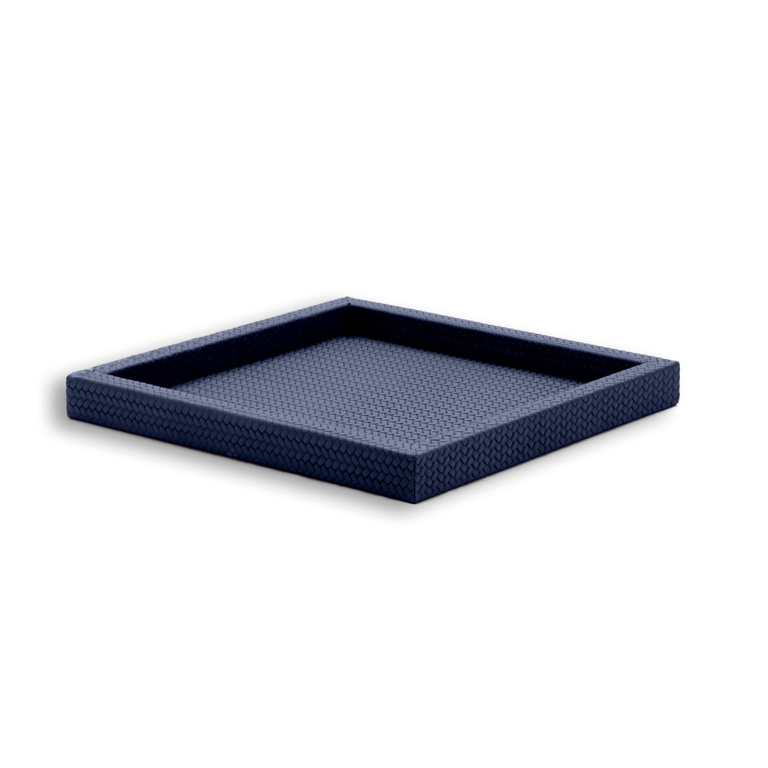 Navy tray from above right, the well shadowed inside four unbroken leather walls