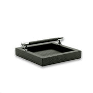 Dark grey-olive napkin holder, a leather-wrapped bar spanning two chromed posts above the 21 cm well