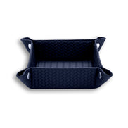 Navy tray, the contrast piping running the full top edge of the woven-embossed leather