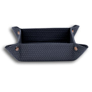 Navy valet tray, bronze-toned press studs fastening the woven-embossed leather at each corner