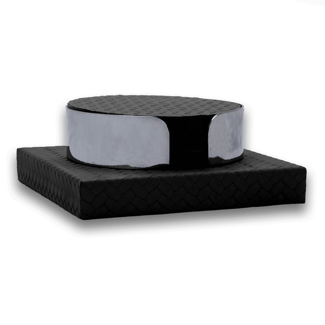 Black coaster stack in a polished steel band, seated on a square woven leather base