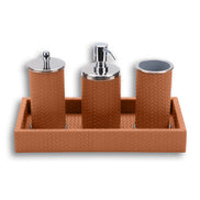Warm tan set, the leather emboss matched across the tray and all three cylinders