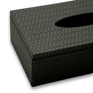 Close corner of the 7.5 cm deep tissue cover, the leather weave turning the lid edge onto the side panel