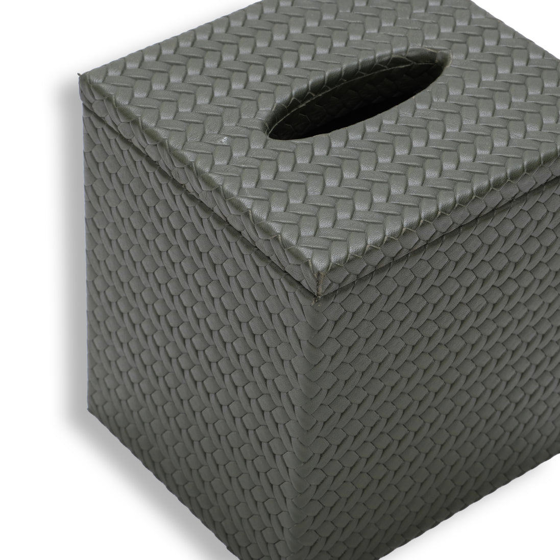 Top of the 14 x 12 cm tissue cover, its oval slot cut through the woven leather lid that overhangs the body