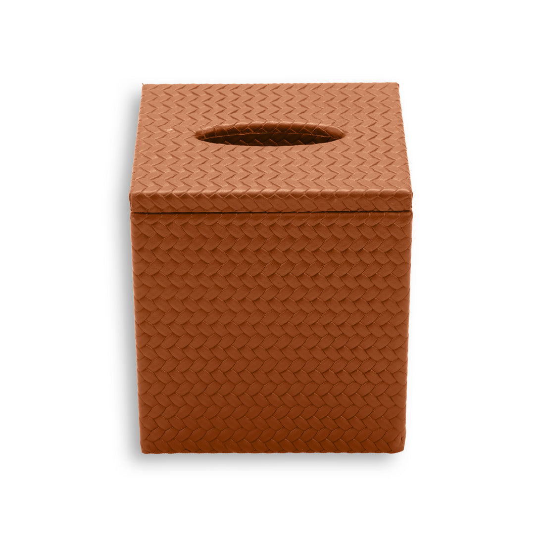 Terracotta tan cover, the leather weave catching light along the lid overhang