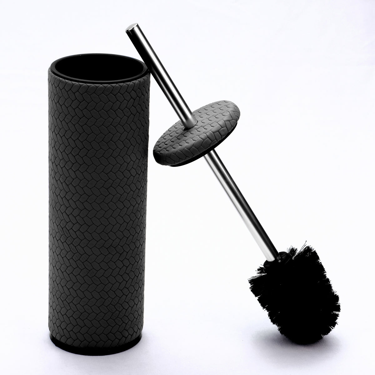 Brush drawn out of its 27.5 cm leather holder, black bristles below the steel rod and leather lid