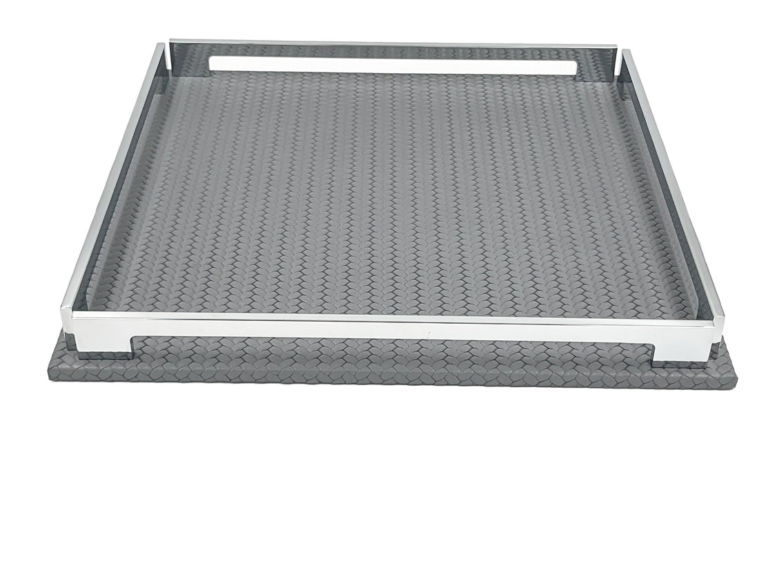 Grey 37 × 37 cm tray at a low angle, front rail raised above the woven leather floor