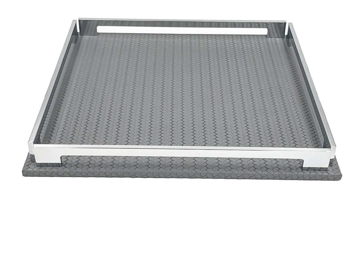 Grey 37 × 37 cm tray at a low angle, front rail raised above the woven leather floor