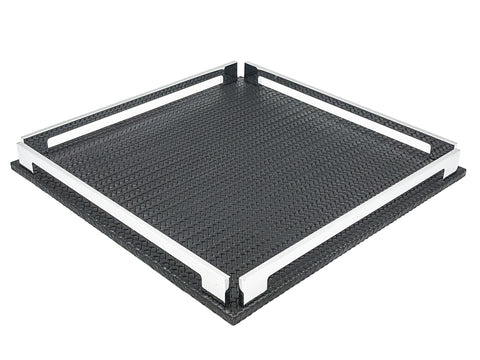 Black 37 × 37 cm square tray from above left, two full-length steel rails framing the woven-embossed leather floor