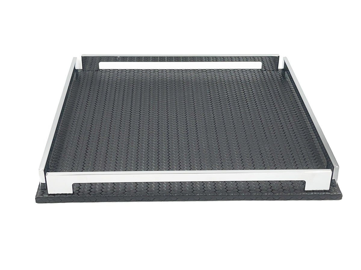 Low view of the black 37 cm tray, front steel rail across the frame and the leather floor receding behind