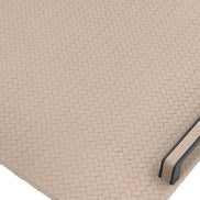 Close on a rounded corner, small honeycomb cells embossed across the leather and the panel edge showing its 1 cm profile