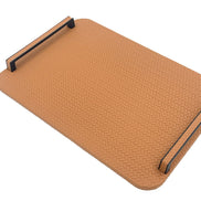 Caramel tan panel, black steel handles standing on blocks above the 1 cm leather board