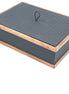 Slate-grey 32 × 23 cm box closed, walnut rails top and bottom around honeycomb-embossed leather