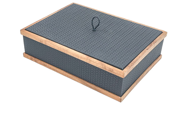 Slate-grey 32 × 23 cm box closed, walnut rails top and bottom around honeycomb-embossed leather