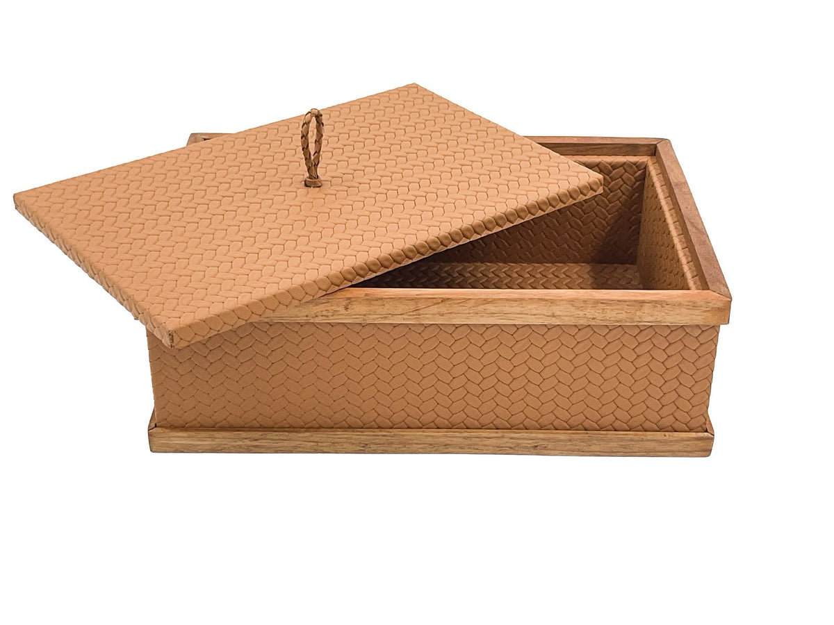 The 27 × 19 cm tan box with the lid lifted off and tipped across it, walnut frame and leather lining in view
