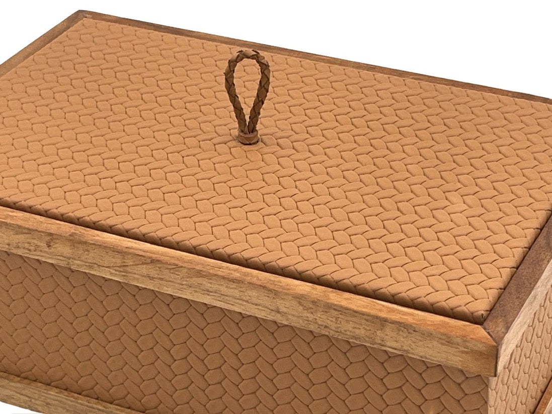 Tan leather lid on the 27 x 19 cm box, the plaited pull anchored through a washer in the basketweave panel
