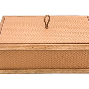 The closed box level from the front, its walnut plinth running the full 27 cm width beneath leather panels