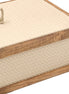 Close on the cream box, a braided leather pull standing on the lid inside its walnut rail