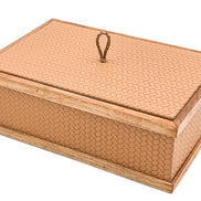The 27 x 19 cm box seen from above and to one side, two leather faces meeting at a walnut-capped corner