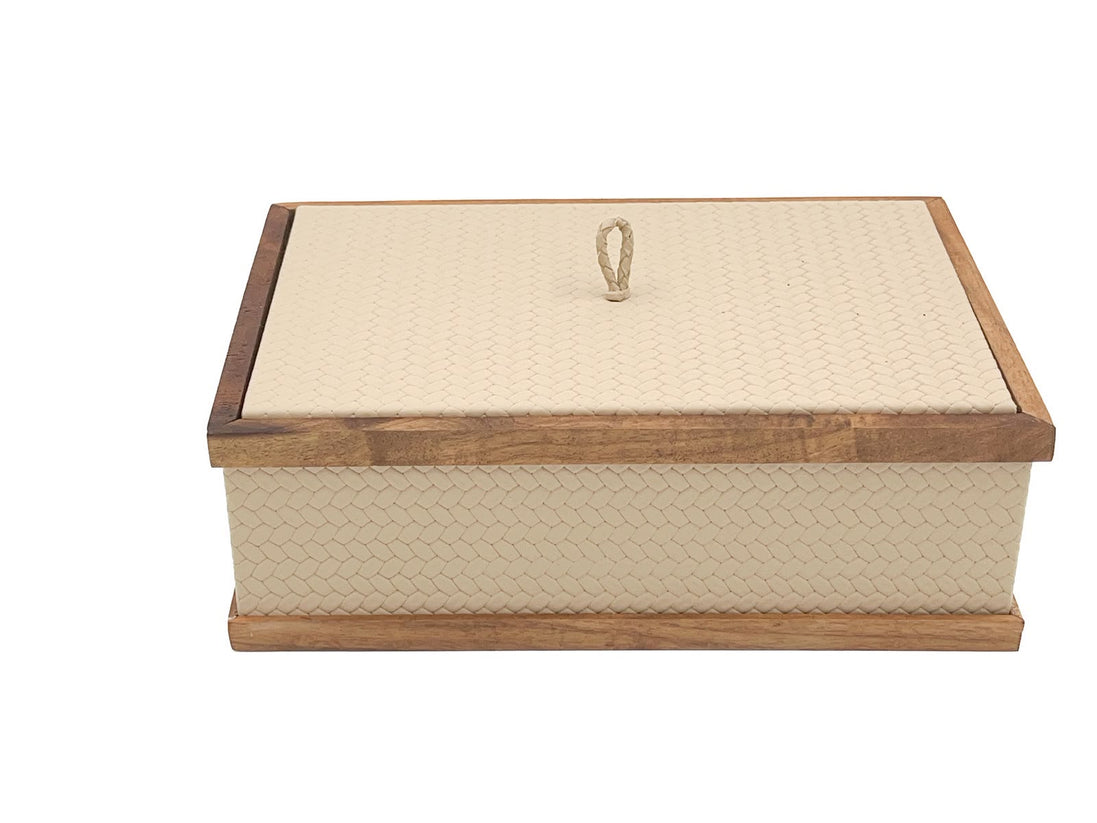 The rectangular 27 x 19 cm box shut, its scalloped leather panels set between walnut rails