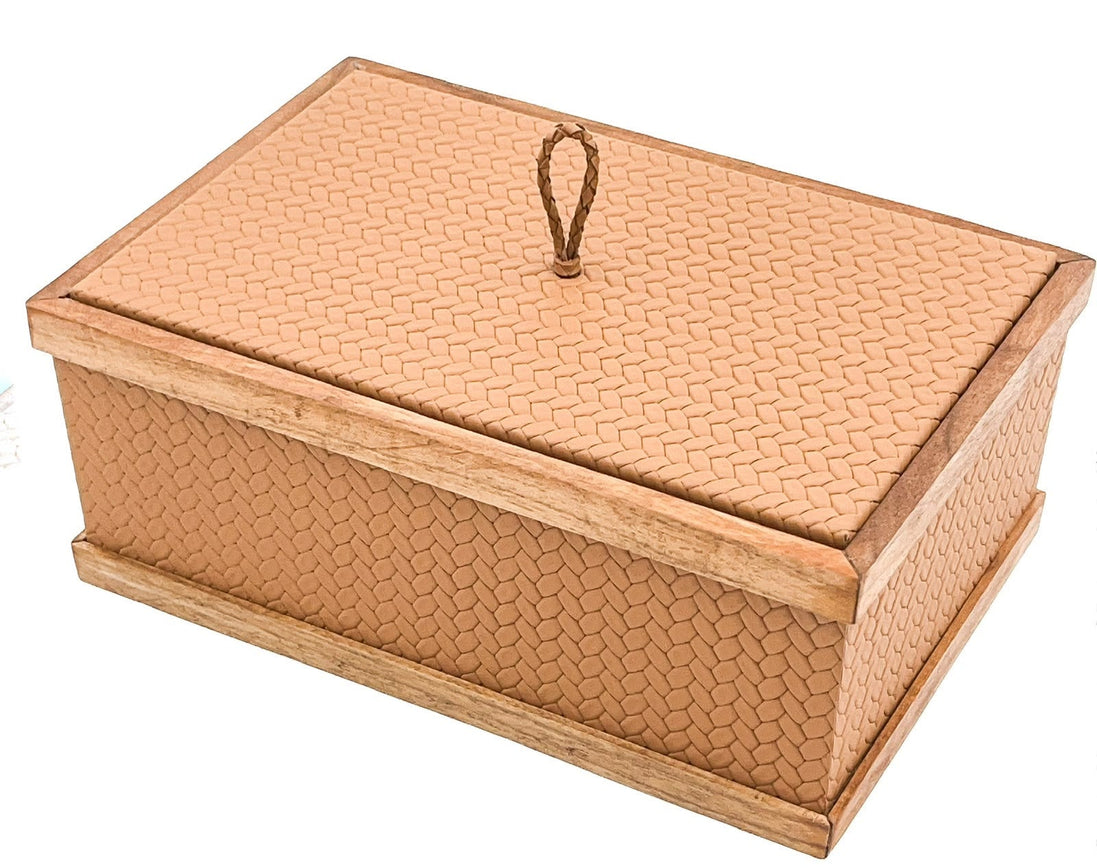 Salmon-tan woven leather box, walnut rails capping both lid and plinth around the 7 cm wall