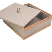 The lid lifted clear and propped across the open box, the walnut rail framing a leather-lined 7 cm well