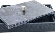 The large box shut with a dark marbled lacquer lid, 5.5 cm of woven leather wall beneath it