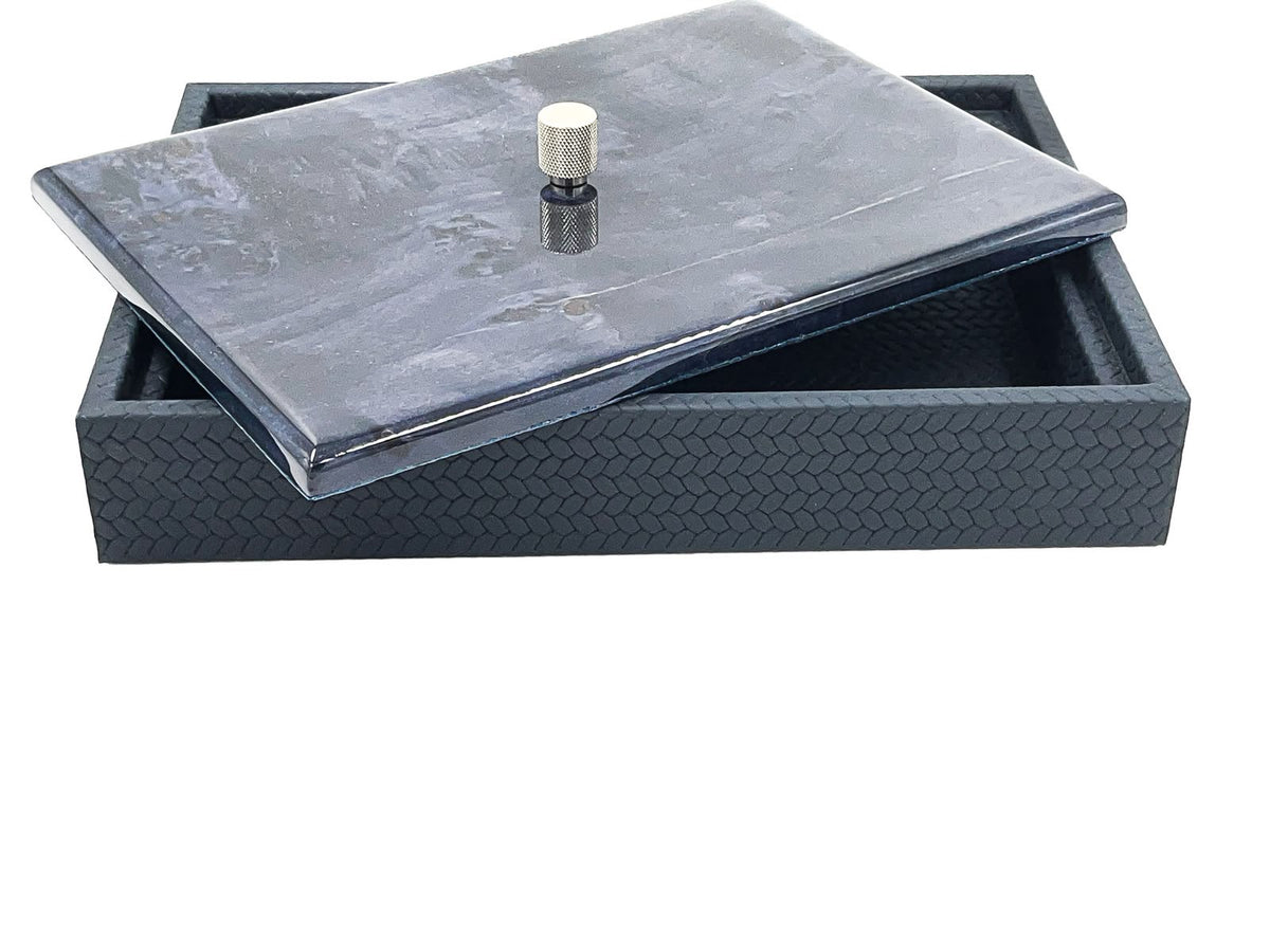The large box shut with a dark marbled lacquer lid, 5.5 cm of woven leather wall beneath it