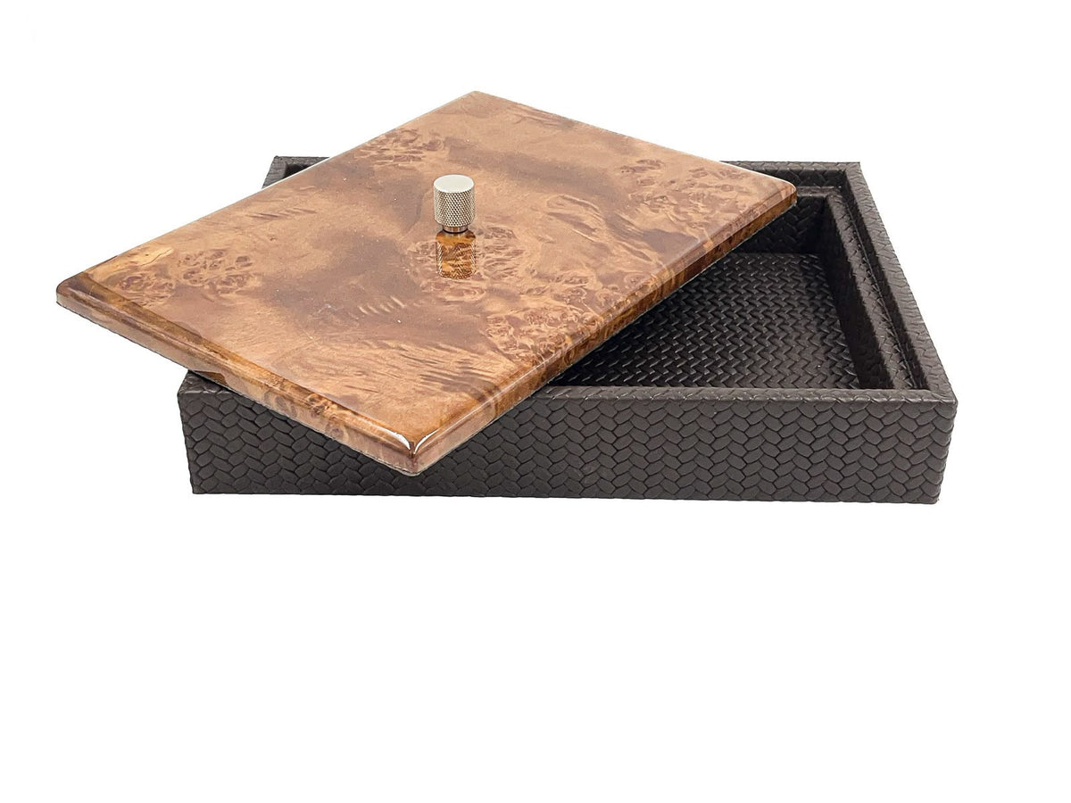 Dark brown box with the burl lid tipped open, showing the woven leather lining of the 5.5 cm well
