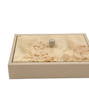 Cream box closed, a pale blond burl lid seated inside the 27.5 cm woven leather rim