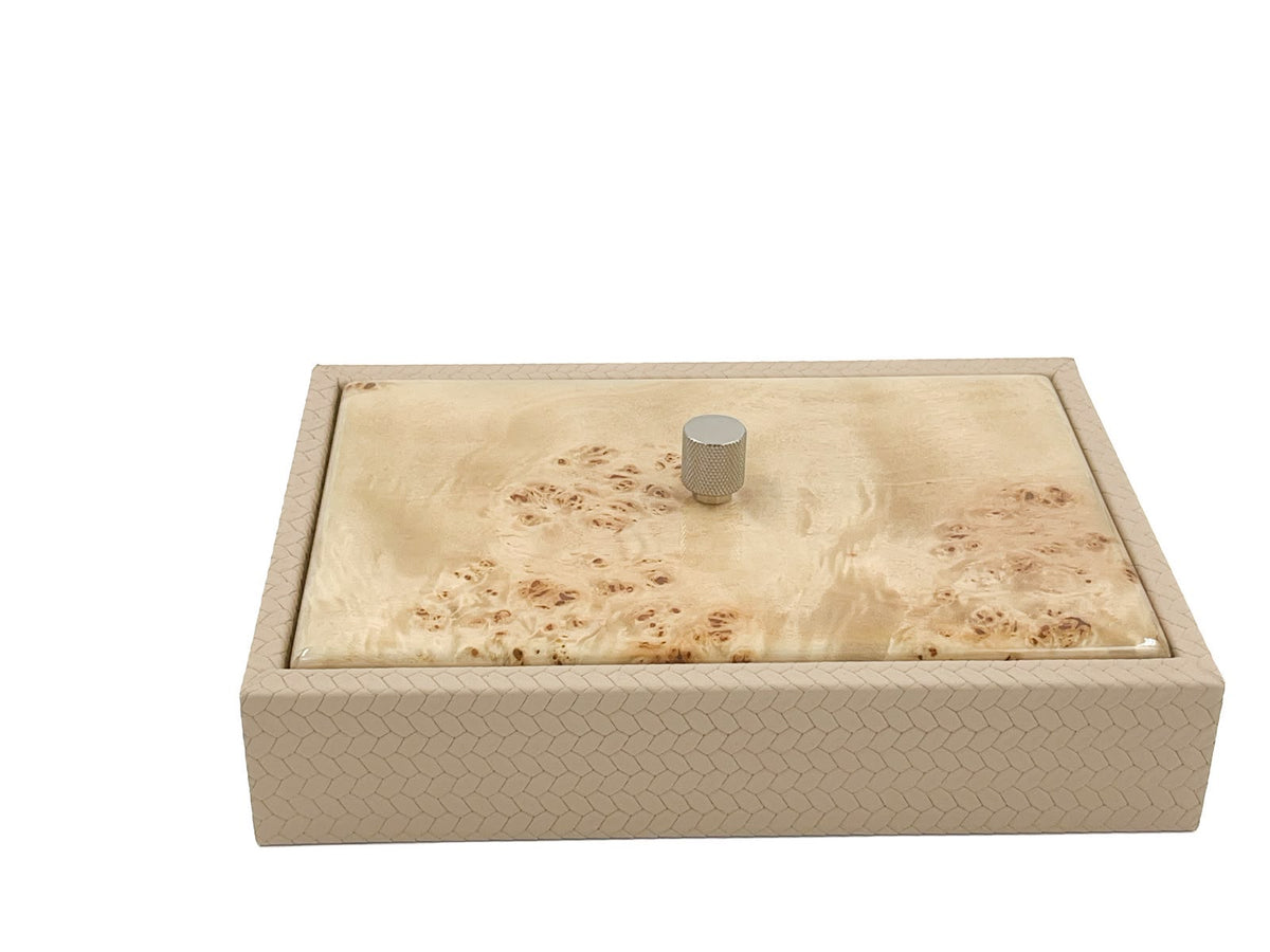 Cream box closed, a pale blond burl lid seated inside the 27.5 cm woven leather rim