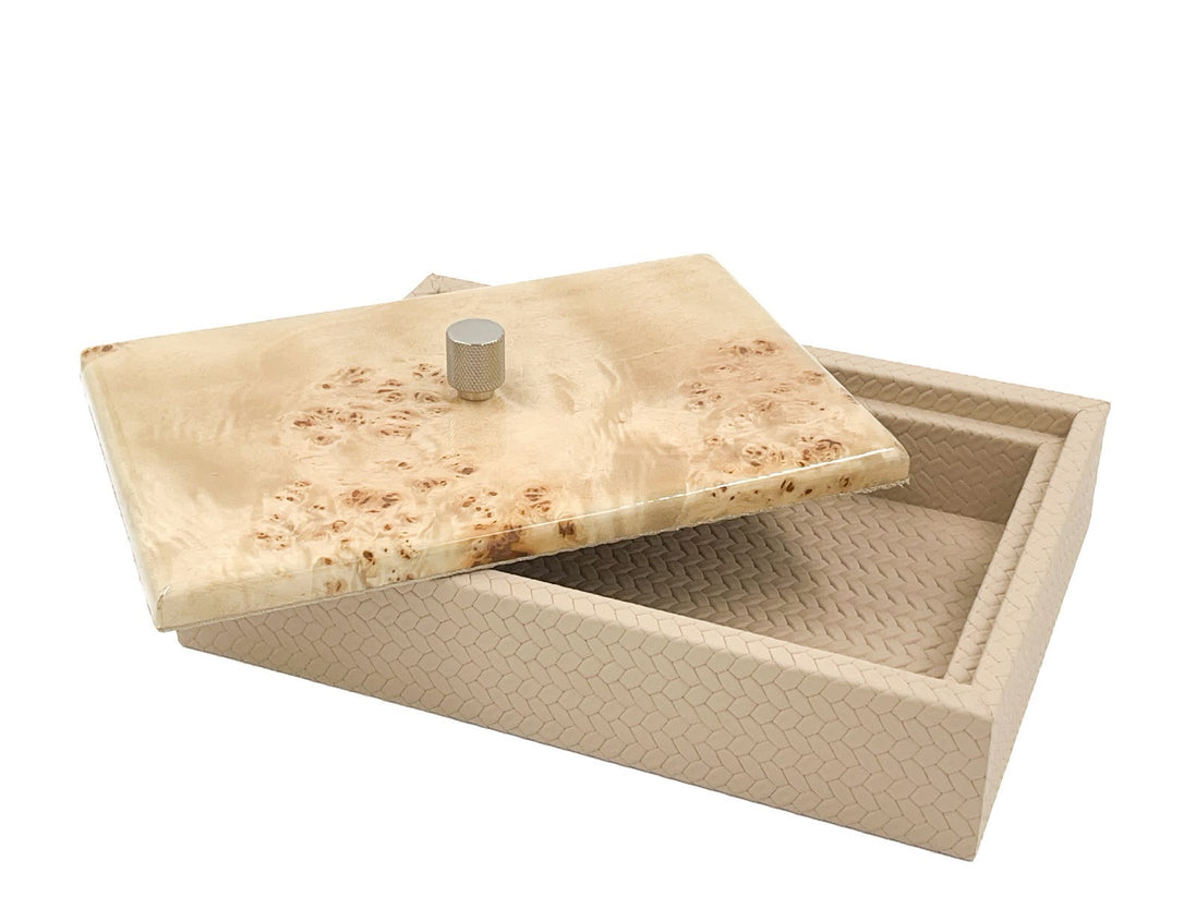 The lid slid clear of the 27.5 x 20 cm box, pale burl grain above an open leather-lined well
