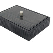 A leather box 5.5 cm deep with a lacquered wood lid, a knurled metal knob standing at its centre