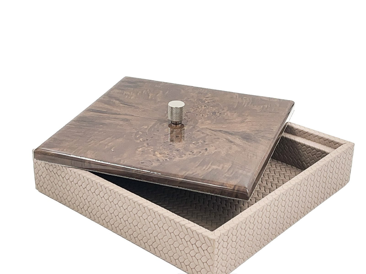 The 27 x 27 cm box with its mahogany lid slid aside, a knurled metal knob at the centre above the woven leather body