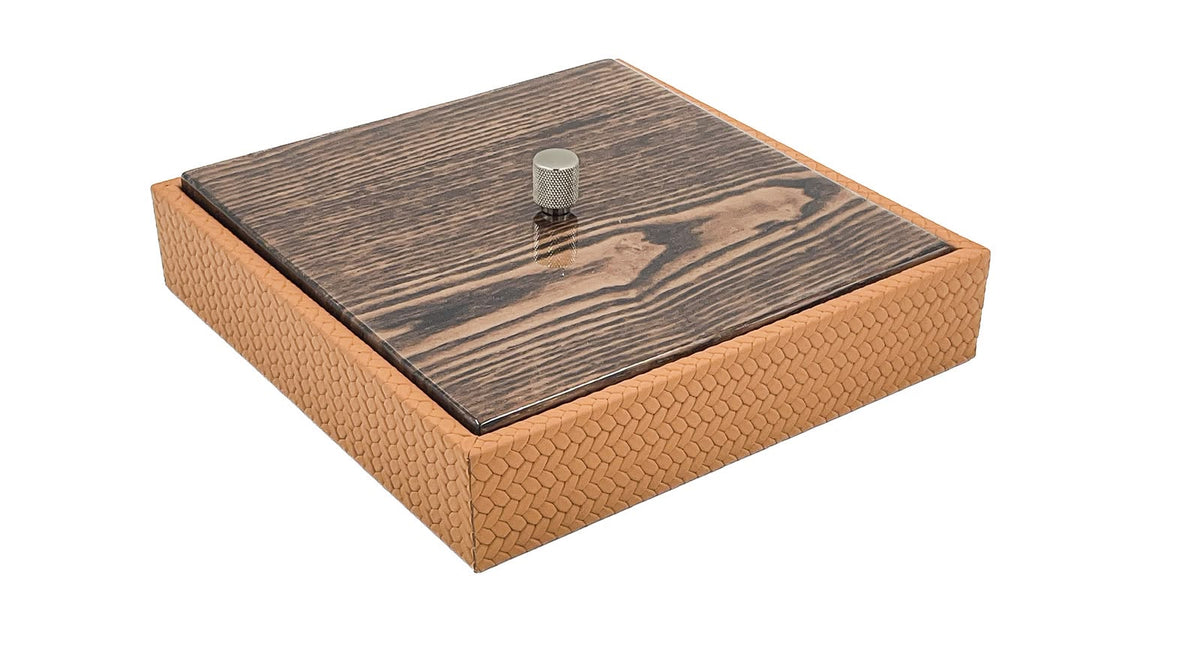 Tan box closed under a grey-figured wood lid, 5.5 cm of woven leather below it