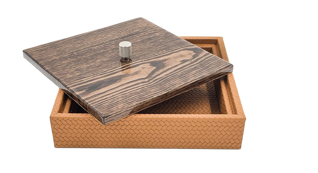 The box open, the mahogany lid tilted across one corner over the 5.5 cm woven leather sides