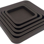 The set from above its right corner, the 42 cm outer tray framing four smaller brown leather squares