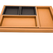 The four inner trays laid in the base, two black leather squares along the top edge and two tan rectangles below