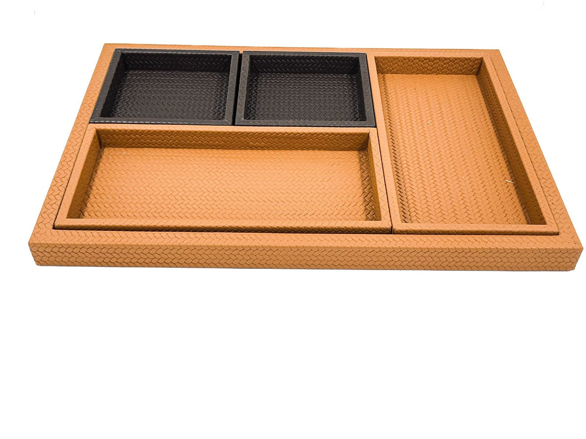 The four inner trays laid in the base, two black leather squares along the top edge and two tan rectangles below