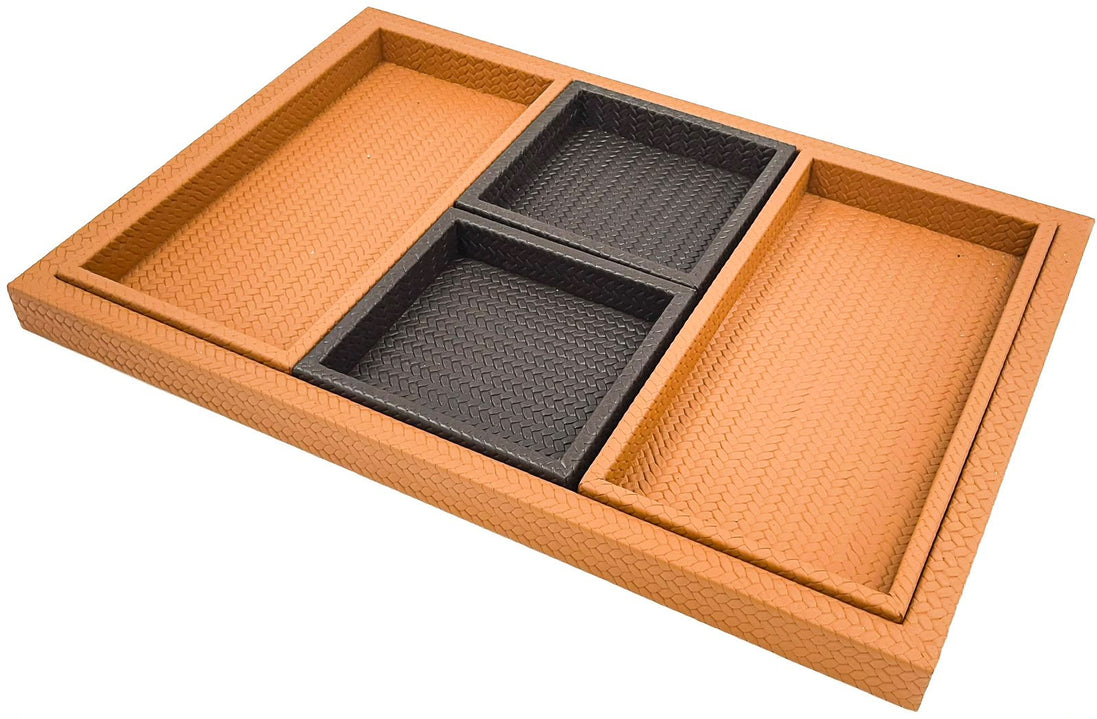 The set seen along its length, the base tray's woven rim standing proud around two black and two tan inner trays