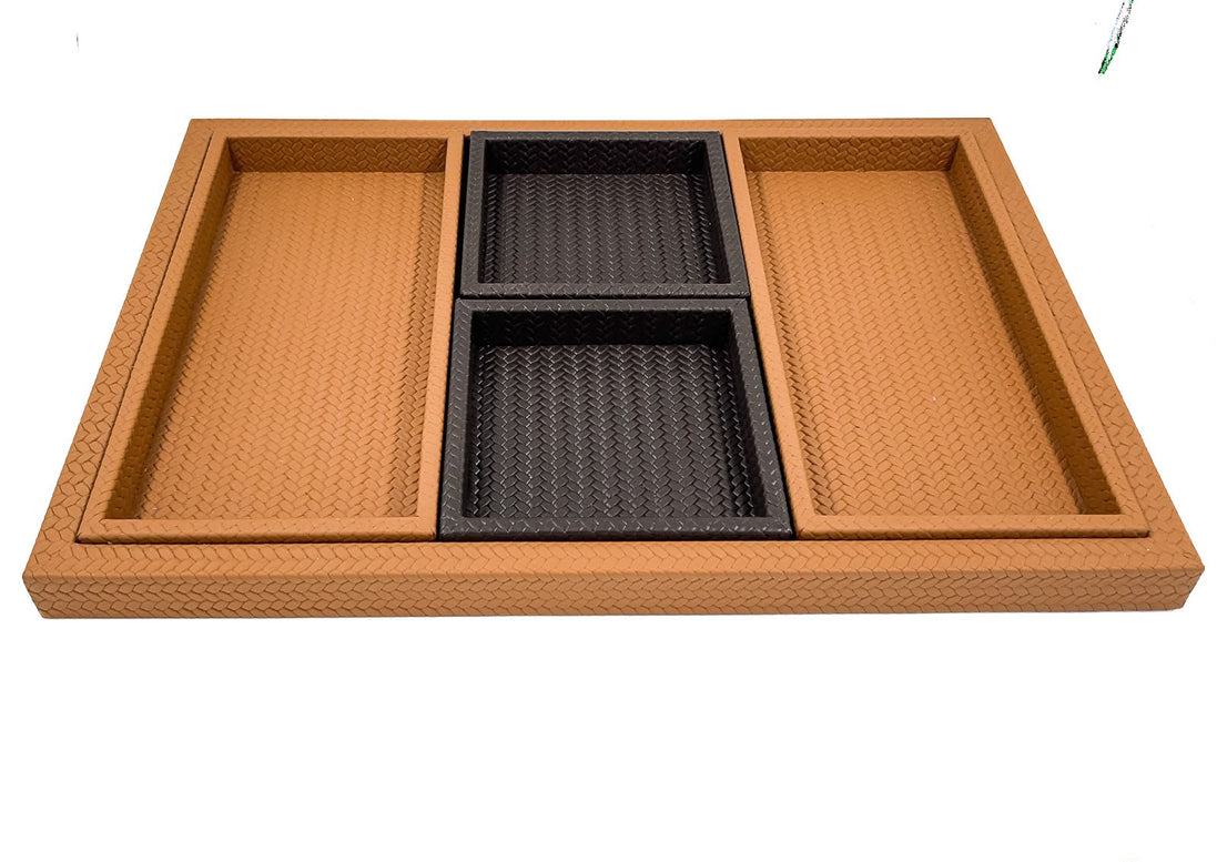 The four inner trays rearranged, a pair of darker leather trays down the centre between two longer pale ones