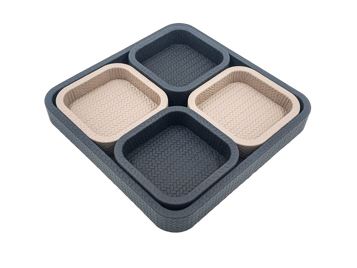The modular tray angled corner forward, four leather wells stepping up from the 37 cm base