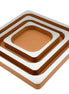 Three nested copper-toned leather squares, mirror-polished tops stepping down from the 41 cm outer tray to the 21 cm centre