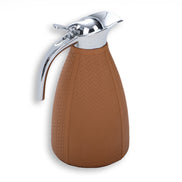 Warm tan thermos, the steel lid seated on a leather shoulder above the 12.5 cm base