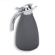 Grey thermos, the leather panel seams running the length of the tapered body