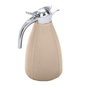 Pale sand thermos, the woven emboss reading in fine chevron rows down the 1.5 litre body