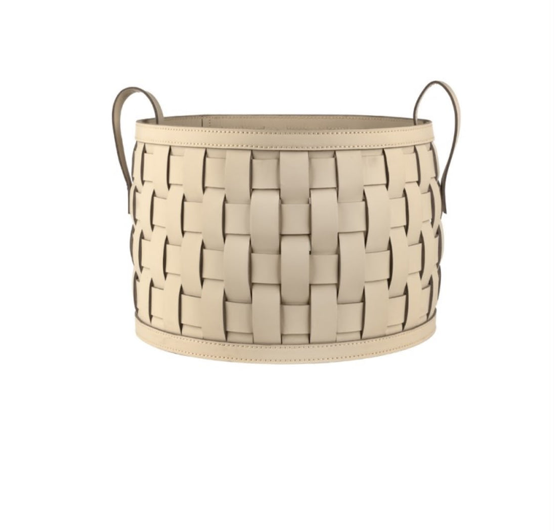 The 36 cm round basket seen whole, wide leather straps woven between stitched bands with a slim rolled handle at each side