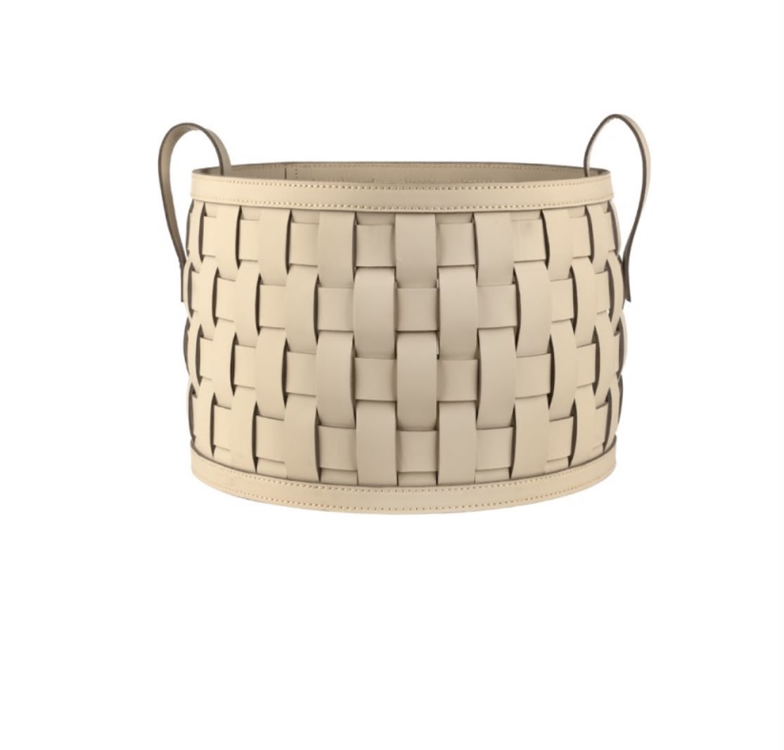 The 36 cm round basket seen whole, wide leather straps woven between stitched bands with a slim rolled handle at each side