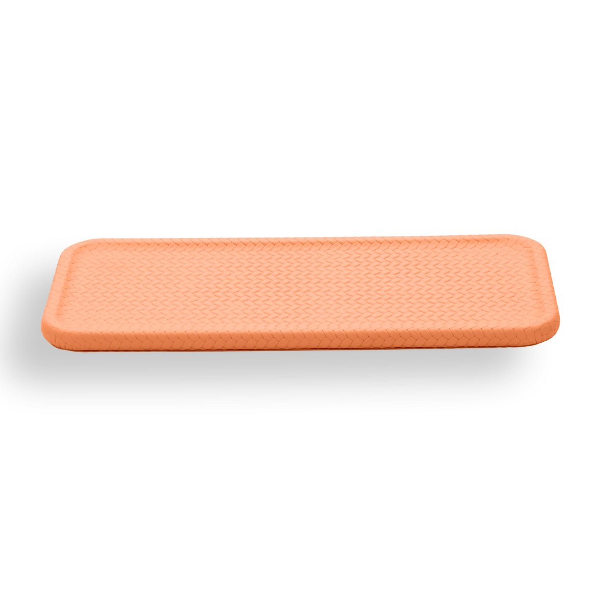 Warm orange placemat, the woven emboss picked out by the light across its 50 cm length